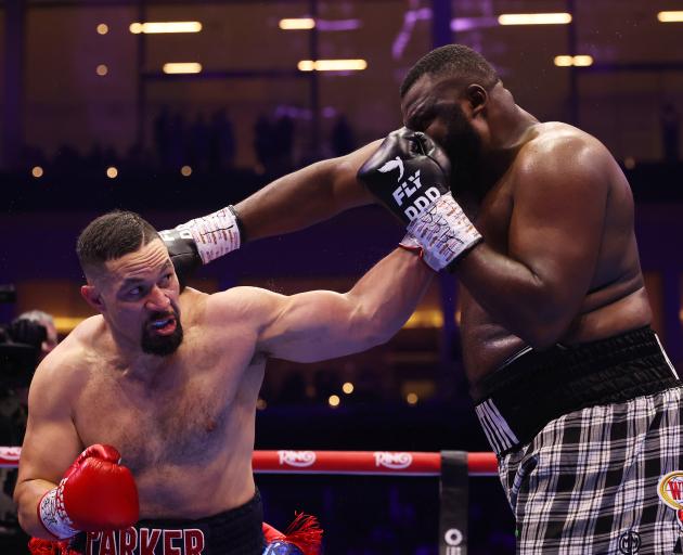 Joseph Parker (left) took just two rounds to see off Martin Bakole in Saudi Arabia. Photo: Getty...