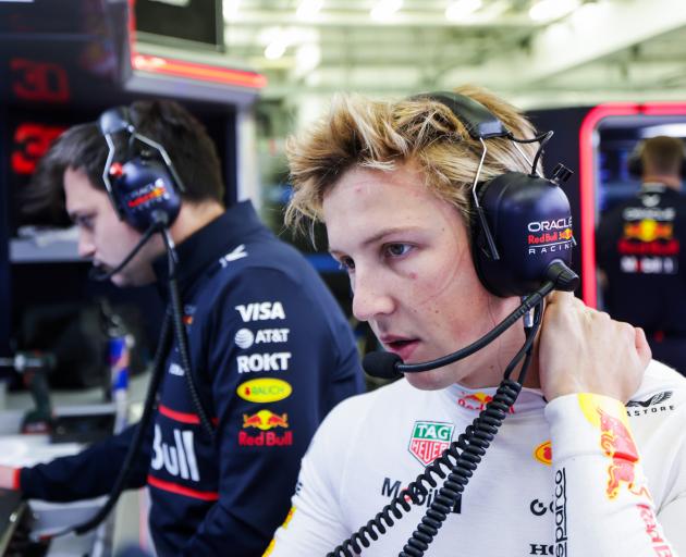 Liam Lawson talks on the radio after a test run, in Bahrain, yesterday. PHOTO: GETTY IMAGES