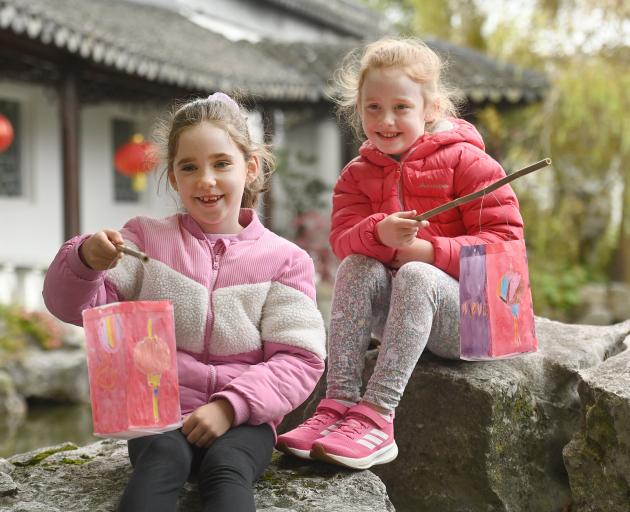 Sisters Addie, 7, and Lissy, 5, Barnett hold lanterns they made at the Lan Yuan Dunedin Chinese...