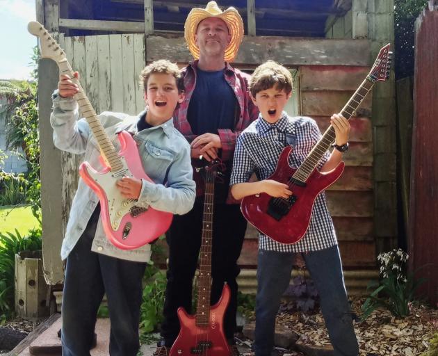 Opening Act — Mud Cake — Morgan Bickley, with his sons Liam, 12, and Harlan, 11, from Riverton,...