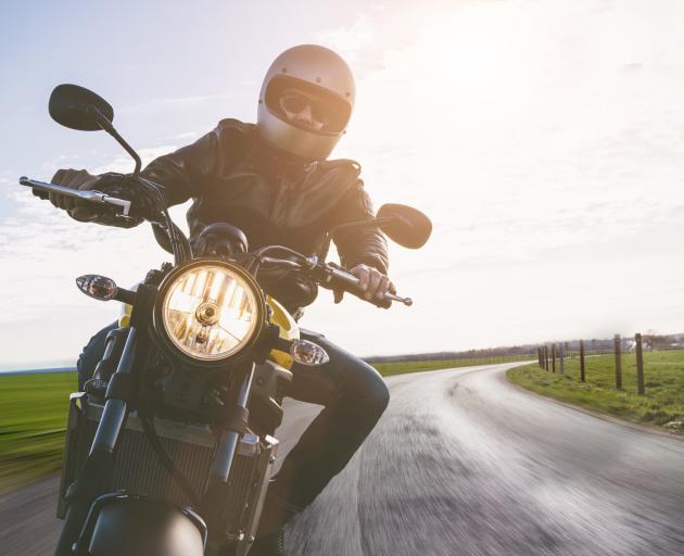A man rides rides a motorcycle on a rural road. Photo: Getty Images A man rides rides a motorcycle on a rural road. Photo: Getty Images