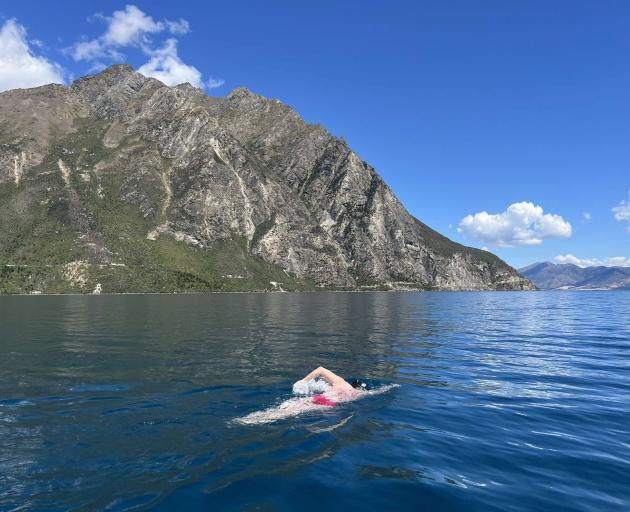 Lake Hāwea swimmer Rachel Armstrong swims past the neck of Lake Hāwea and Lake Wānaka in her bid...