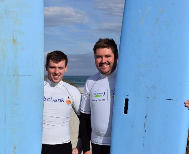 Set for a surf at Brighton Beach are Dunedin Young Farmers Club members Sam Pike (left) and...