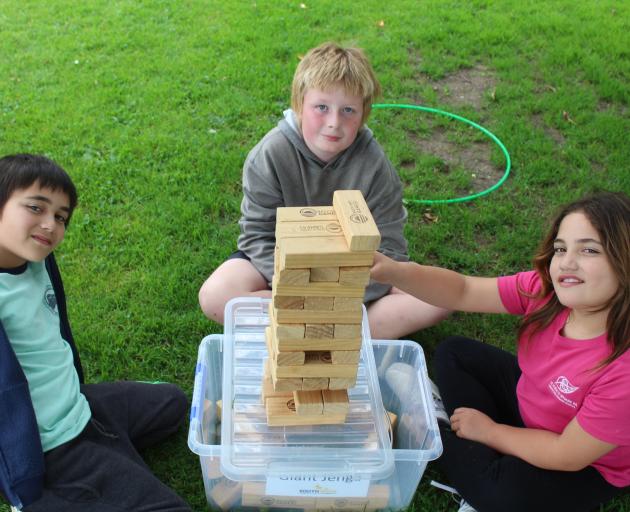 Thompson siblings Creighton, 9 (left), and Jayda, 8, take on school friend Dejaye Hopwood, 10, in...