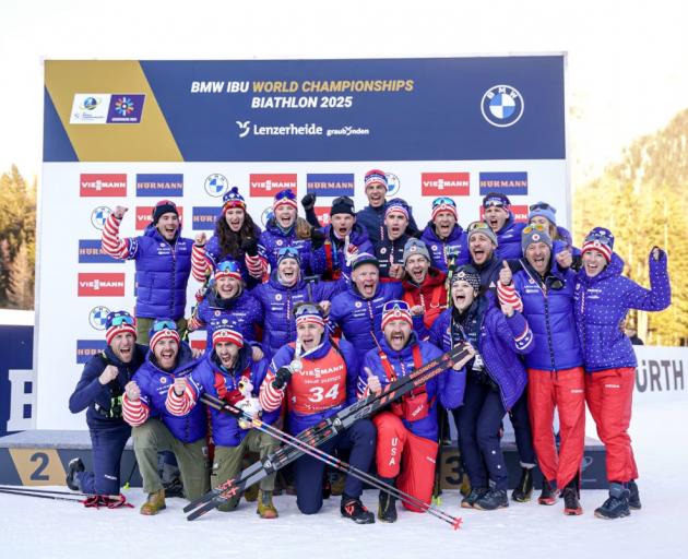 Wanaka biathlete Campbell Wright, (bib 34, front row) celebrates with the United States biathlon...