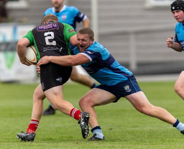 Bradley Cross tackling Eastern Northern Barbarians hooker Mykel Sleeman in his first game back in...