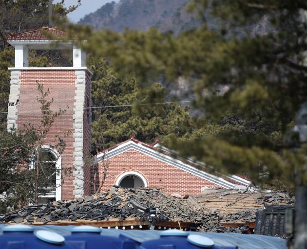 A damaged church after bombs fell outside the shooting range during joint live-fire exercises on ...
