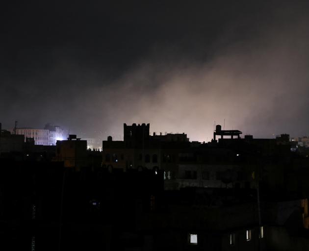 Dust rises from the site of strikes in Sanaa, Yemen on Saturday. Photo: Reuters