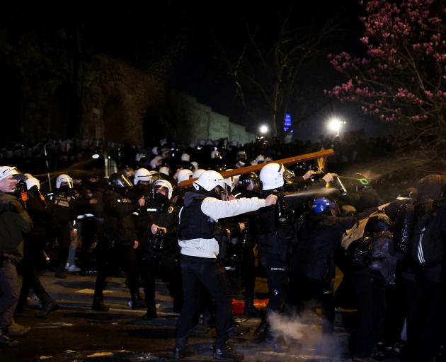 Demonstrators are sprayed during a protest by students against the detention of Istanbul Mayor...