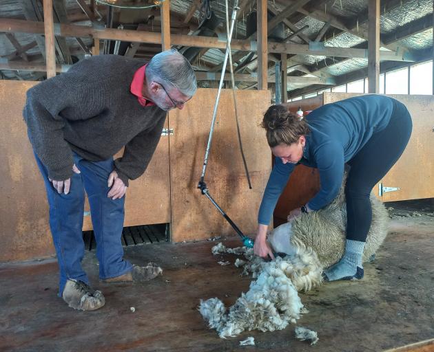 Renee Hooper makes a clean job while Colin Gibson watches.