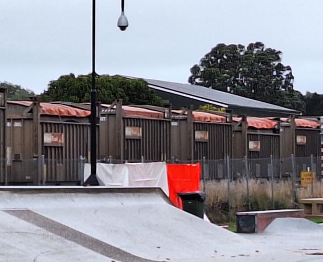 A tarpaulin covers the scene where a pedestrian was struck and killed by a train. PHOTO: NINA TAPU