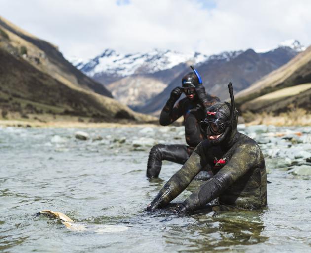Otago Fish & Game officers Ben Sowry (left) and Mason Court prepare to drift-dive the Upper Lochy...