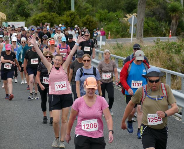 Competitors in the Papatowai Challenge are in good spirits as they set off on the 15.5km walk and...