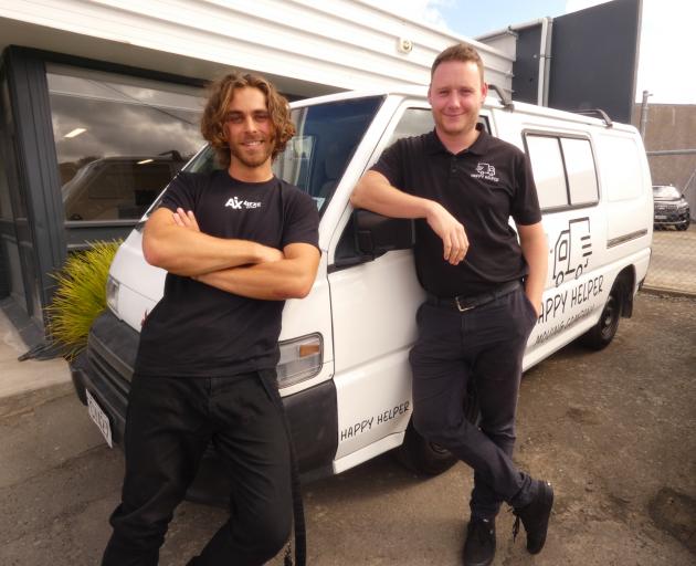 Happy Helper Moving Company partner Fabian Johnson, left, and founder Tony Joyce with the...