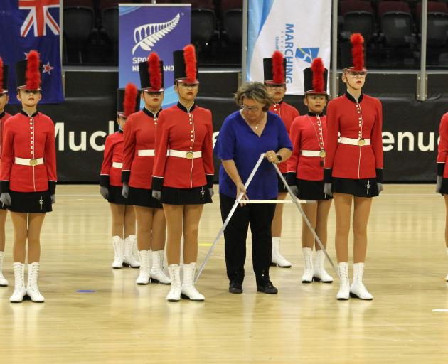 A judge inspects the Buckingham Guards under-13 team from Hawke’s Bay with precision callipers...