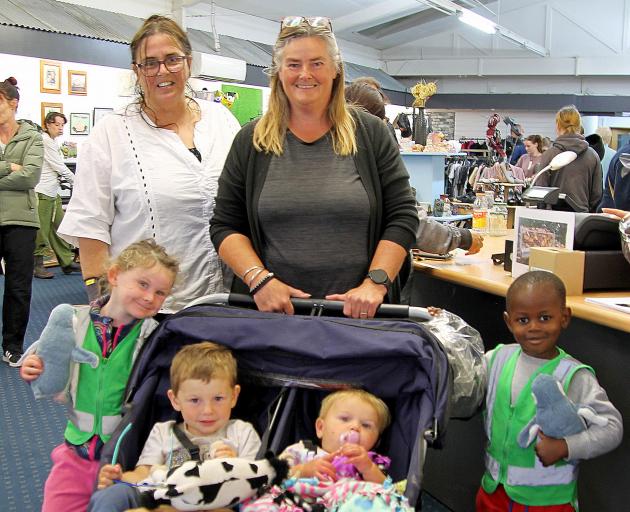 Manager Claire Mackie (left) took a moment with Cheri Shanks who had just treated (from left)...