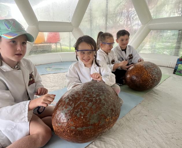 Ada Hunter, 7, Luna Edwards, 4, Skular Edwards, 6, and Hudson Taumata, 6, are hard at work in the...