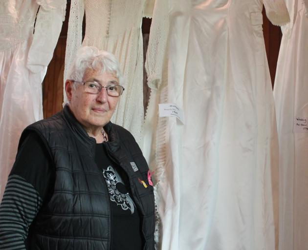 Ngaire Evans with her wedding dress from 1968, made by her aunt. PHOTO: ELLA SCOTT-FLEMING