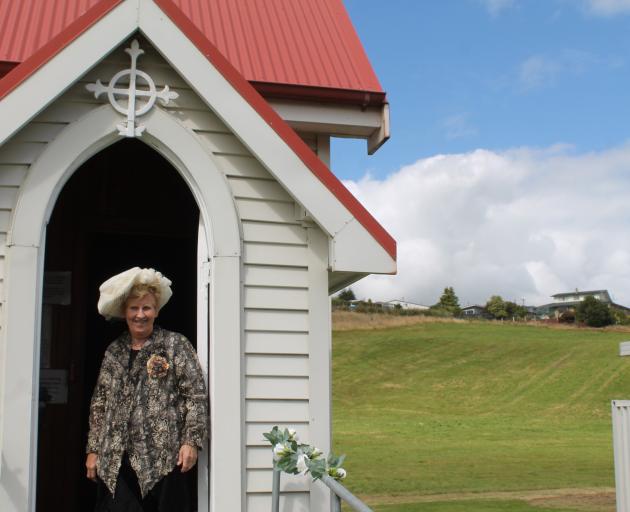 Hokonui Pioneer Village preservationist Thelma Williams stands in the doorway of the church at...