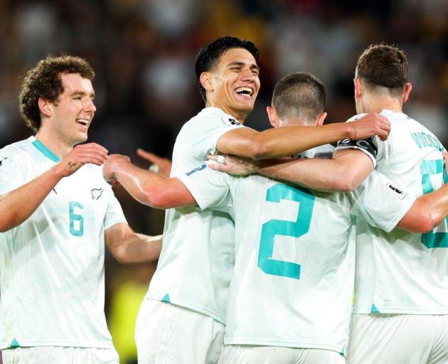 Joe Bell, Marko Stamenić, Tim Payne and Chris Wood celebrate during Friday night's win over Fiji....