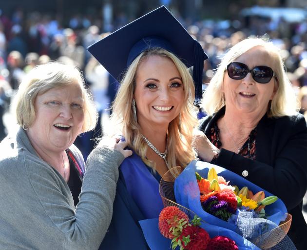 Natalie Morgan (centre) celebrates her graduation with aunt Jacqueline Fox (left) and mother...