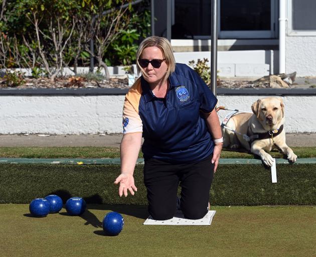 Sonya Woodrow and guide dog Vesna enjoy a game of blind lawn bowls at the Forbury Bowling Club....