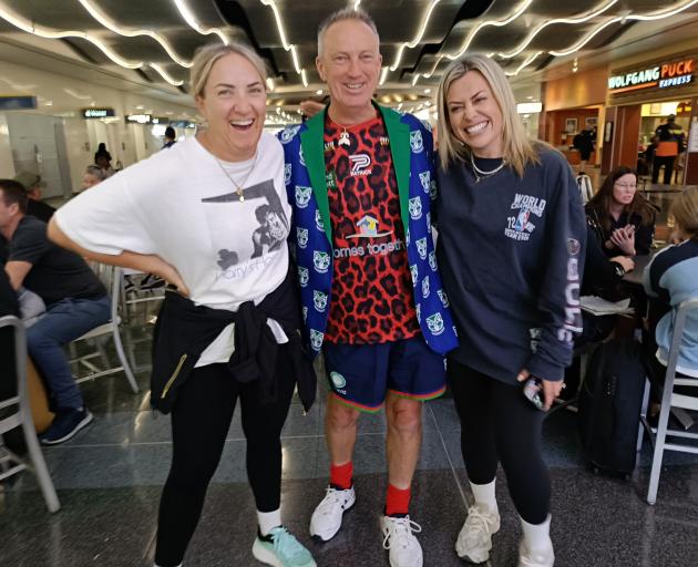 Up the Wahs! Warriors fan Tom Jones, of Tapanui, meets television presenters Brodie Kane (left)...