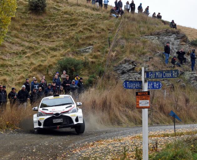 Spectators watch Mike Young at last year’s Otago Rally, near Middlemarch. PHOTO: DAVID THOMSON