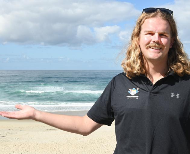 Surf Lifesaving Otago Southland club support leader Felix Cook points out a rip at St Kilda Beach...