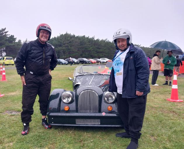 Morgan Sports Car club member David Schlock (left) prepares to take Invercargill man Mike Thomas...