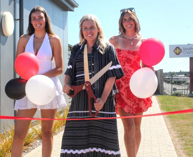 Melissa Vining celebrates the opening of the Southern Charity Hospital yesterday with her...