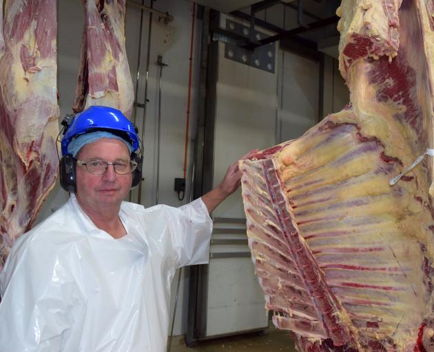 Inspecting the marbling on a prime carcass in a chiller at the Mataura plant is Alliance Group...