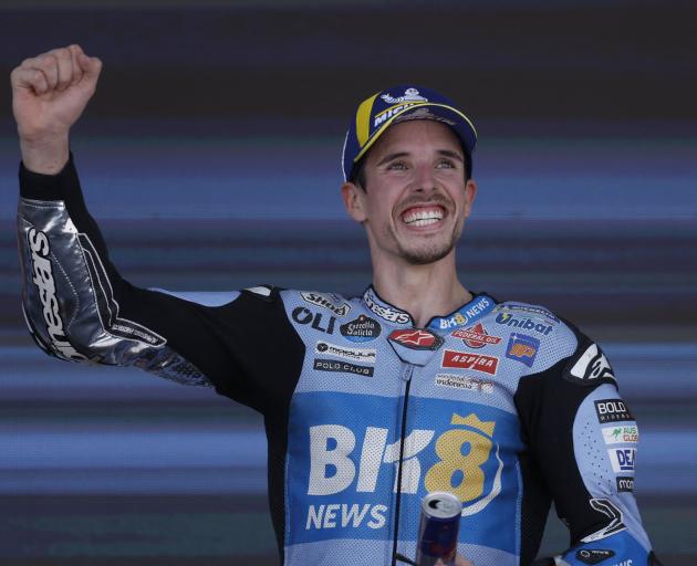 BK8 Gresini Racing MotoGP's Alex Marquez celebrates on the podium after winning the race. PHOTO:...