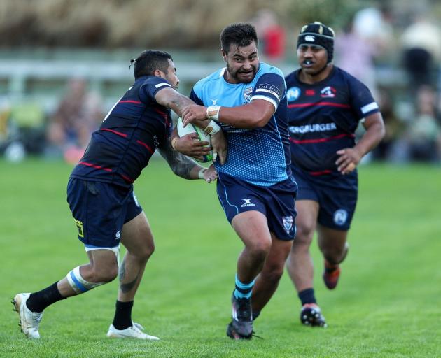 Wakatipu winger Xavier Sadler, in his 50th game for the Prems, tries to shrug off Arrowtown first...