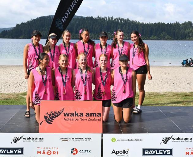 Whakatipu Waka Ama Club’s Mako and Whai crew after receiving their medals. PHOTO: SUPPLIED