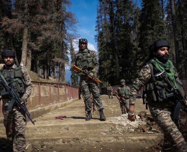 Indian security personnel near the site of the a suspected militant attack on tourists Kashmir....