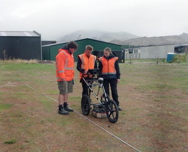 The Southern Geophysical team (from left) George Dart, Jack Fleming and Jess MacFarquhar scan the...