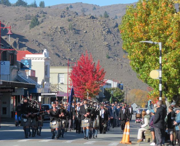 The Alexandra parade is led down Tarbert St to the cenotaph by the Alexandra and Districts Pipe...