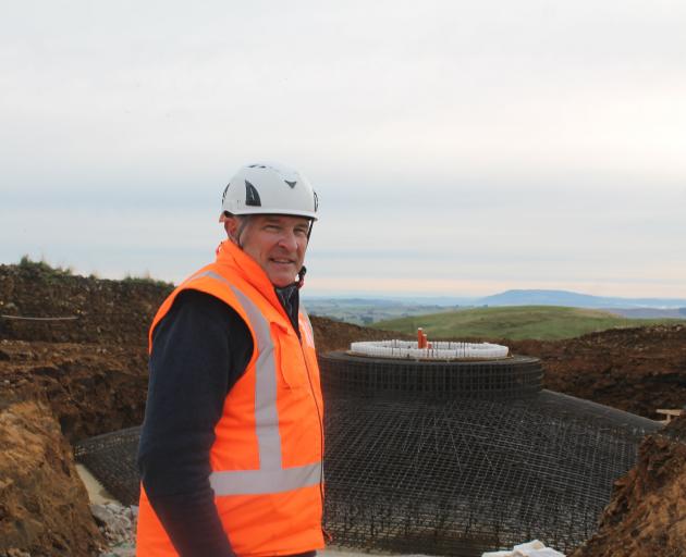 Kaiwera Downs site manager Stuart Davie shows off a cage ready to be poured with concrete to...