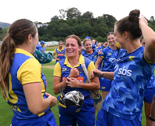 Otago Sparks star Eden Carson (centre) celebrates with team-mates after their dramatic...