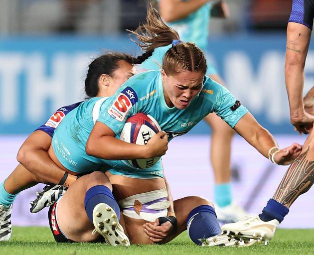 Kaipo Olsen-Baker of Matatū is tackled.
