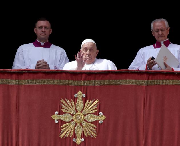 Pope Francis delivering his Urbi Et Orbi Blessing from the balcony overlooking St. Peter's Square...