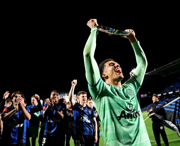 Auckland FC goalkeeper Alex Paulsen celebrates with the Premiers Plate at Go Media Stadium...