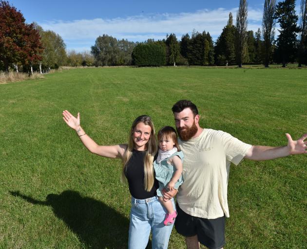 Joel Parry and his fiancee Caitlin Barclay, holding their daughter Annabelle, want to give away...