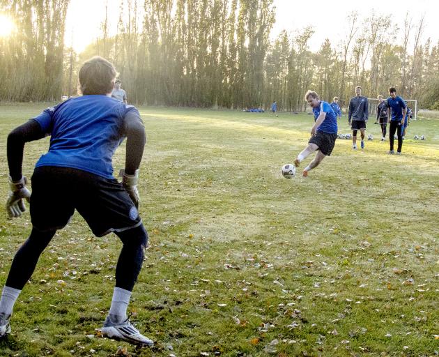 Sports reporter Sam Coughlan tries to find the back of the net past goalkeeper Ben Graney. PHOTO:...