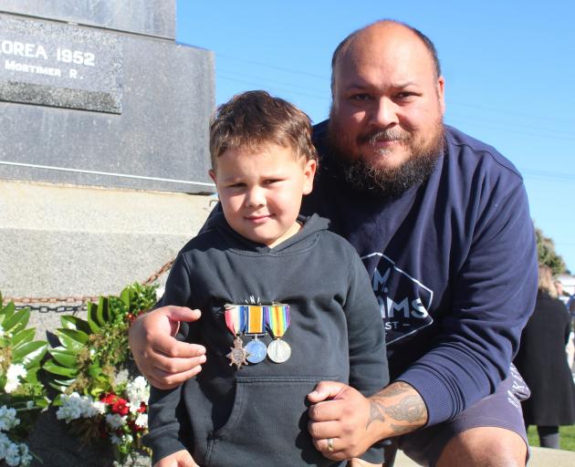 Kayson, 4, and Callum Jones at the Bluff Cenotaph for the civic service. PHOTO: NINA TAPU