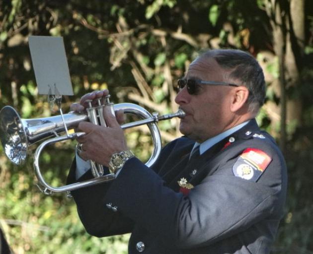 Andrew Hayes plays the bugle at the Duntroon Anzac Day service for the 60th consecutive year...