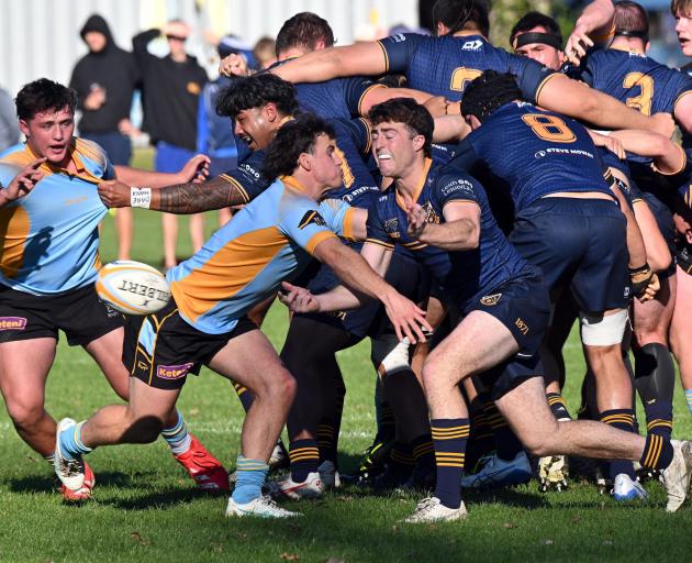 Halfbacks clash during the Dunedin premier rugby match between University and Dunedin at Logan...