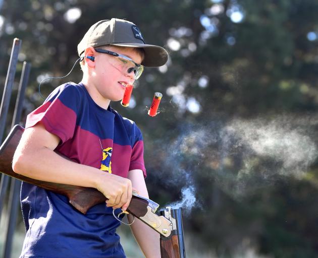 Kaitangata Primary School pupil Robbie Lane, 11, ejects two 12 gauge shells during a range shoot...