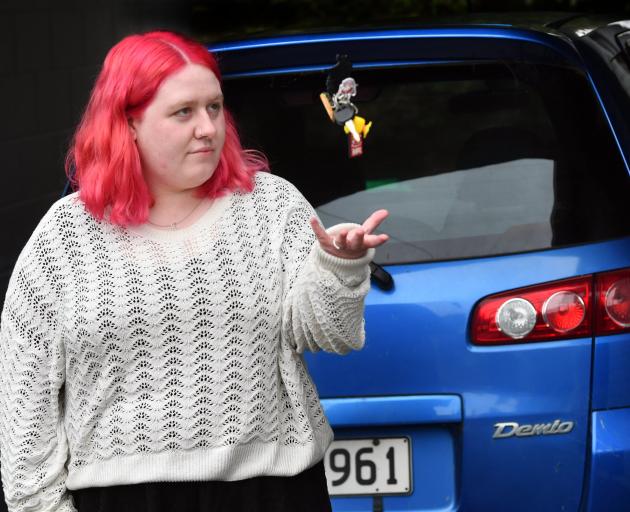 Andersons Bay resident Breeanna Rawlinson with her Mazda Demio which was stolen from outside her...